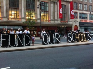 PSU Members holding signs that read "Fund Our Schools"